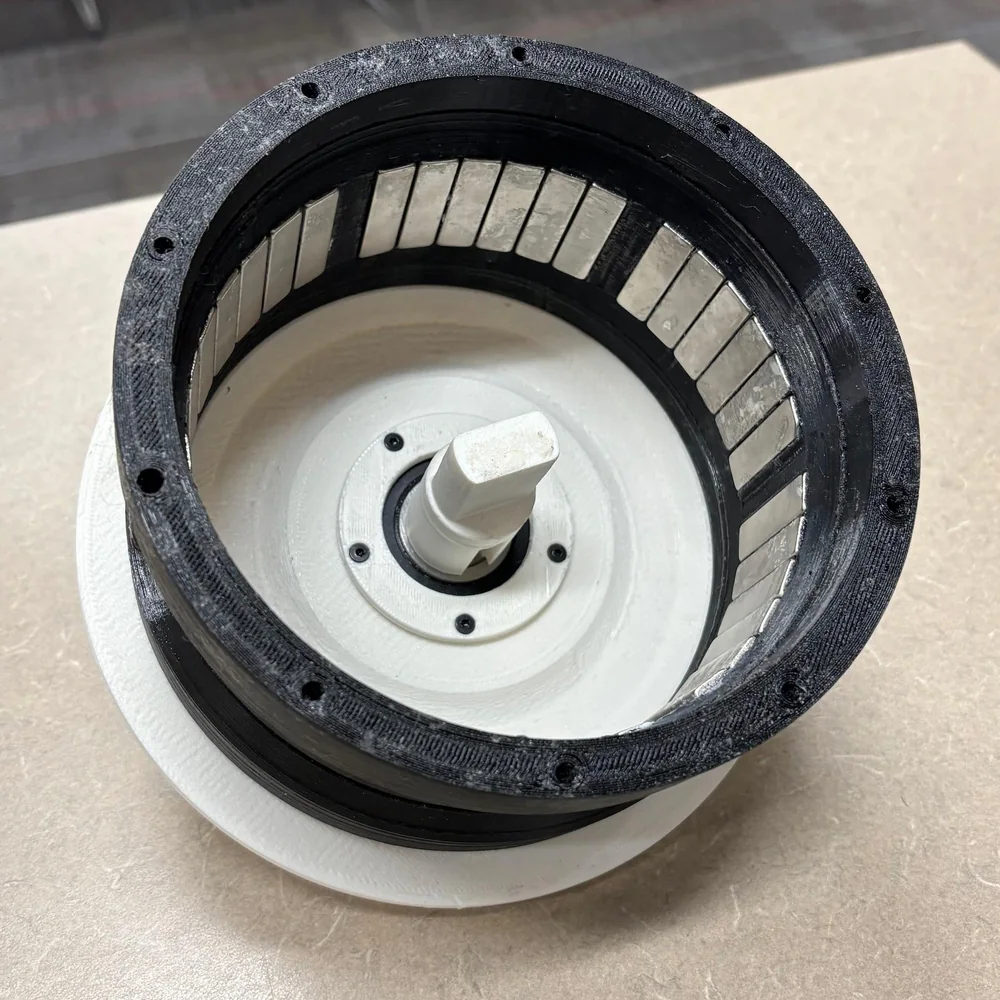 Rotor with block magnets arranged to approximate wide arc magnets
