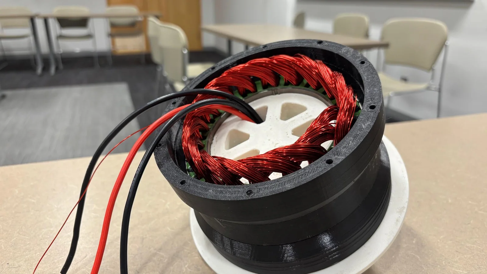 The wound stator seated in its printed housing