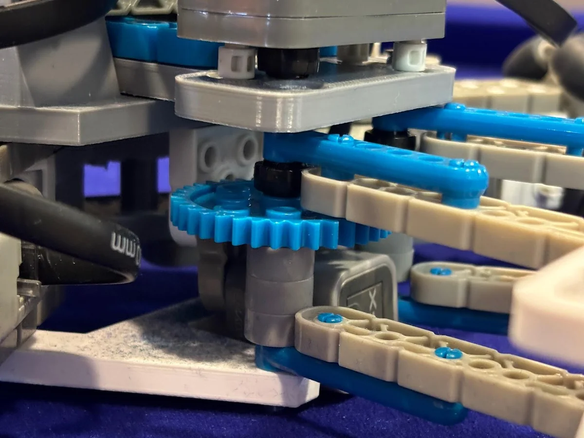 Close-up of the scissor linkage driving the striking face