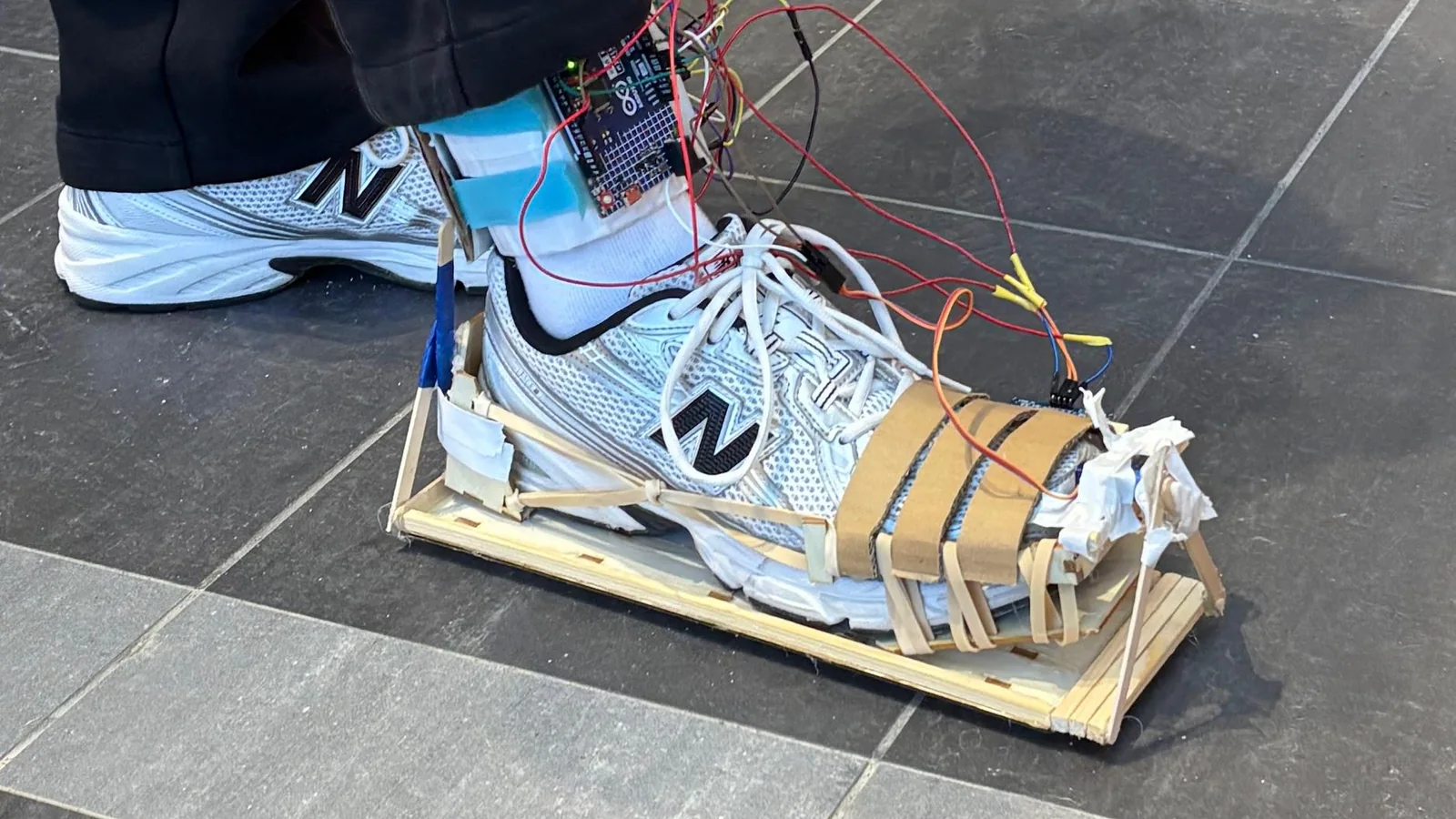 AutoCleat mounted on a shoe with its control electronics