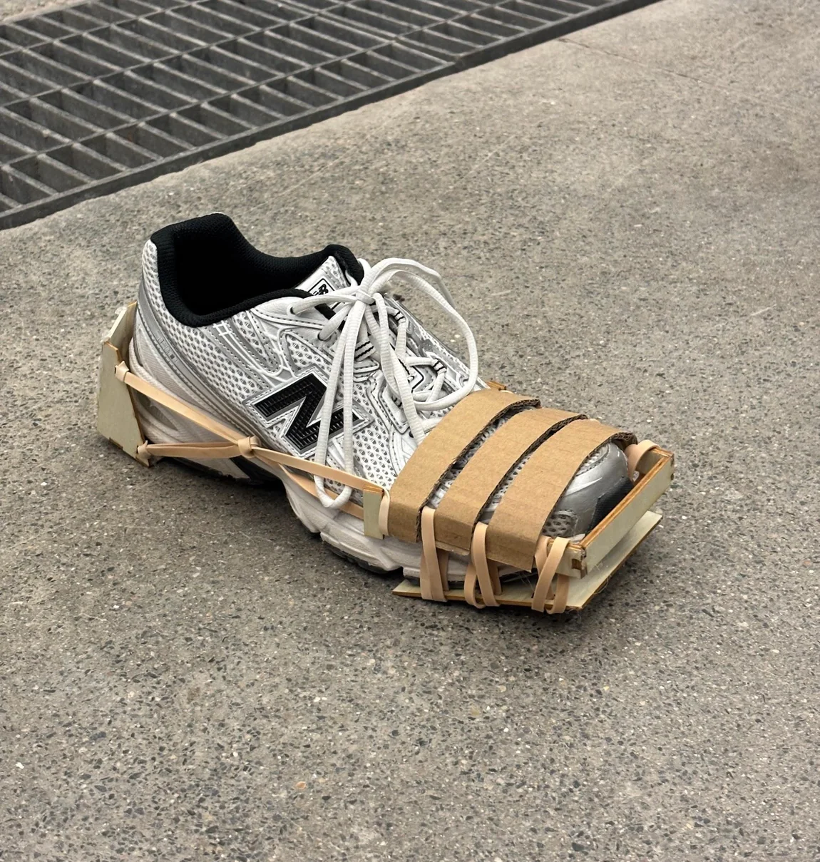 Side view of the AutoCleat frame strapped to a shoe
