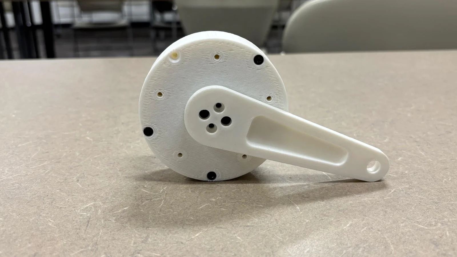 The printed cycloidal gearbox with its output arm attached